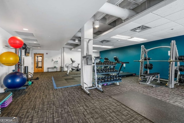 gym with carpet and a drop ceiling