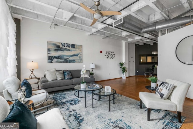 living room with hardwood / wood-style floors and ceiling fan