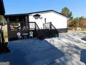 rear view of house featuring a patio