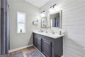 bathroom with wood-type flooring and vanity