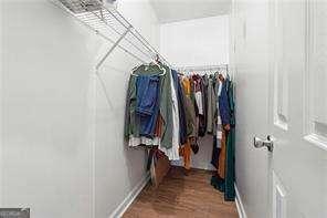 walk in closet featuring wood-type flooring