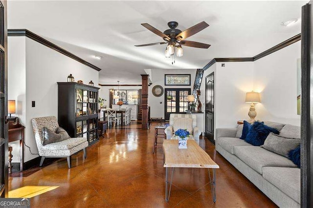 living room featuring french doors, ceiling fan, ornamental molding, and concrete flooring