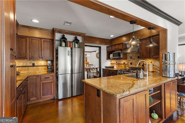 kitchen with sink, appliances with stainless steel finishes, backsplash, light stone countertops, and decorative light fixtures