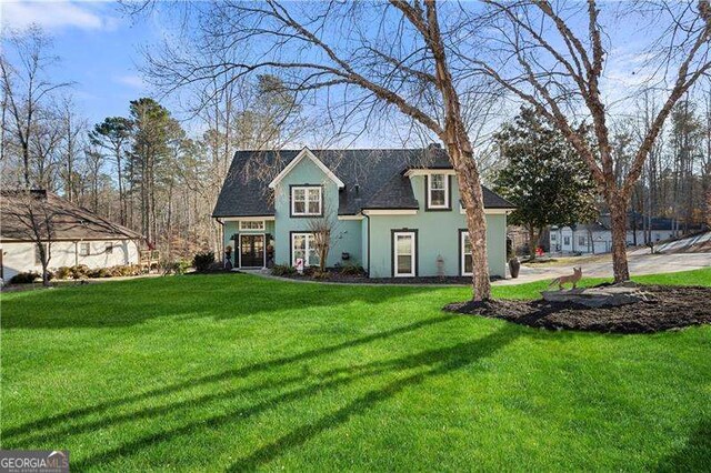 view of front of home featuring a front yard