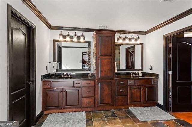 bathroom with vanity and crown molding