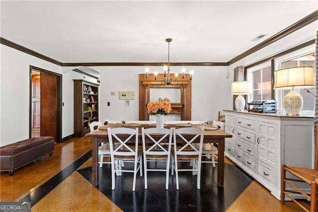 dining room with a notable chandelier and crown molding