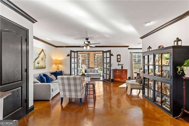 living room with crown molding and ceiling fan