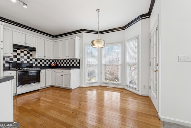 kitchen with white cabinetry, hanging light fixtures, light hardwood / wood-style flooring, and white range with gas stovetop