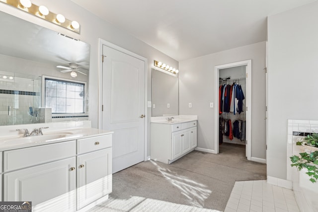 bathroom featuring vanity, an enclosed shower, and ceiling fan