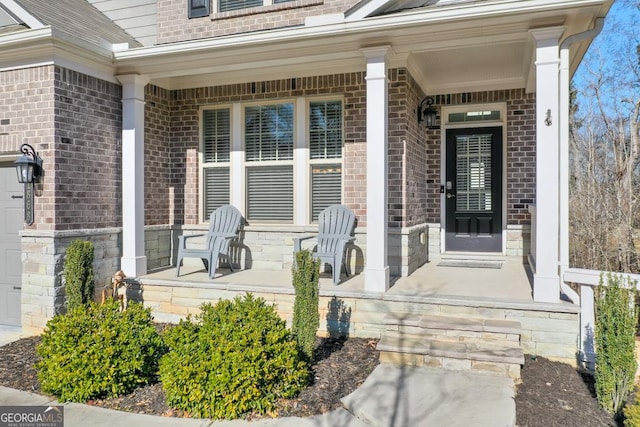 doorway to property with a porch