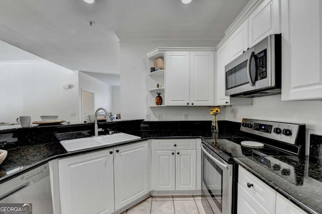 kitchen with white cabinetry and stainless steel appliances