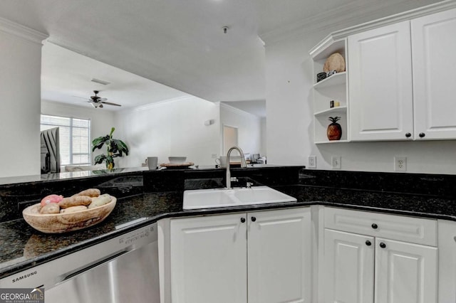 kitchen with sink, crown molding, dark stone countertops, stainless steel dishwasher, and white cabinets