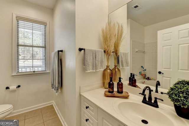 bathroom with vanity, tile patterned floors, and toilet