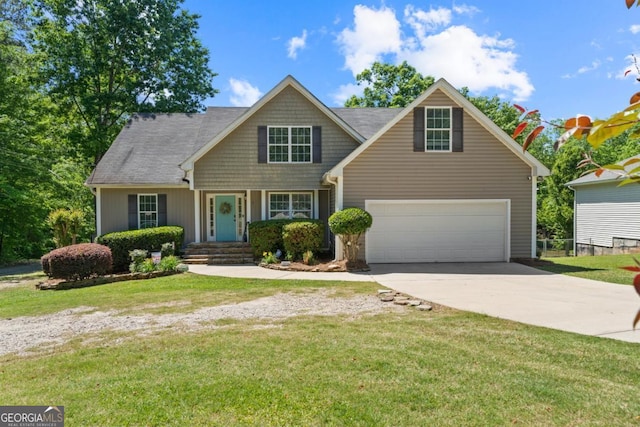 view of front of home with a garage and a front lawn