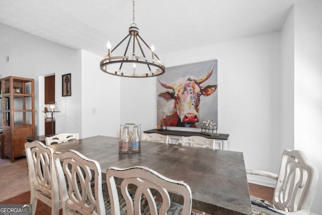 carpeted dining room with a chandelier and vaulted ceiling