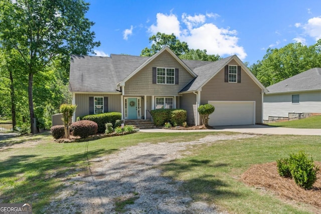 view of front of house with a garage and a front yard