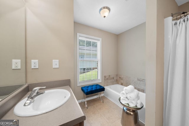 bathroom featuring tile patterned floors, vanity, and shower with separate bathtub