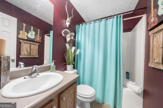 full bathroom featuring shower / bath combination with curtain, vanity, toilet, and a textured ceiling