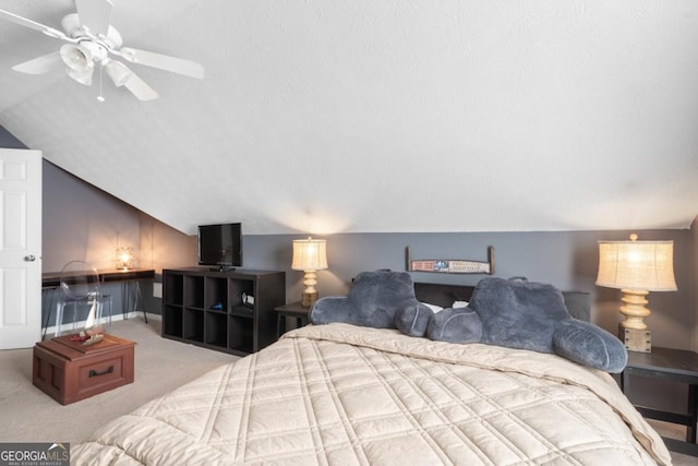 carpeted bedroom with vaulted ceiling and ceiling fan