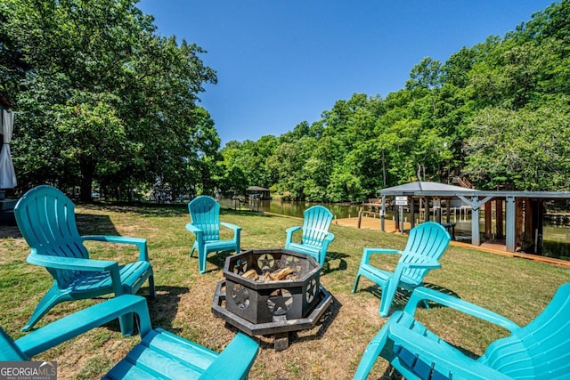 exterior space featuring a gazebo and an outdoor fire pit