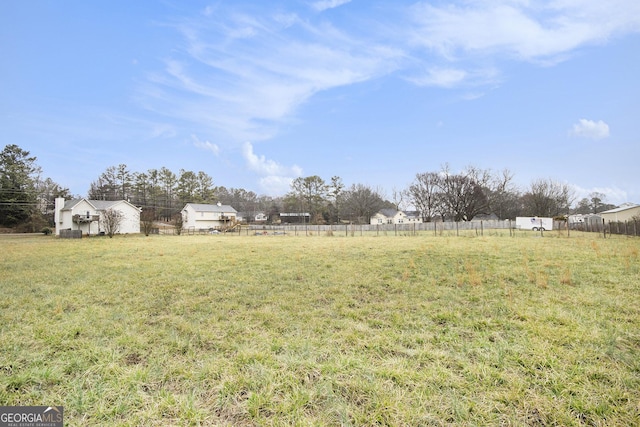 view of yard with a rural view