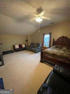 bedroom with vaulted ceiling, carpet, and ceiling fan