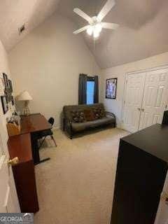 carpeted bedroom with lofted ceiling and ceiling fan