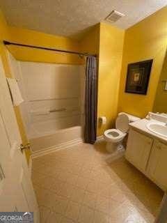 bathroom featuring vanity, toilet, and curtained shower