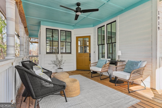 exterior space with ceiling fan and a porch