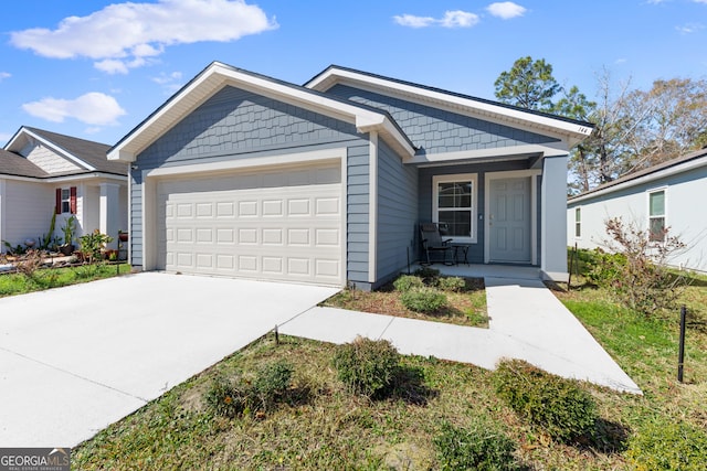 view of front of home with a garage and a porch