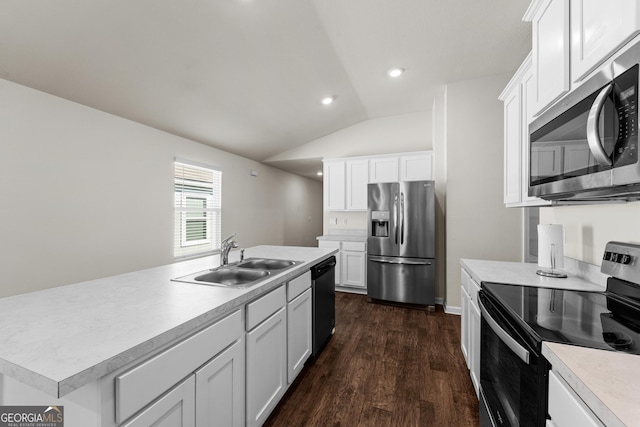 kitchen with dark wood-type flooring, sink, white cabinetry, an island with sink, and stainless steel appliances