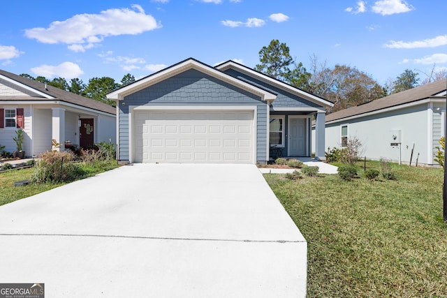 view of front of property featuring a garage and a front lawn