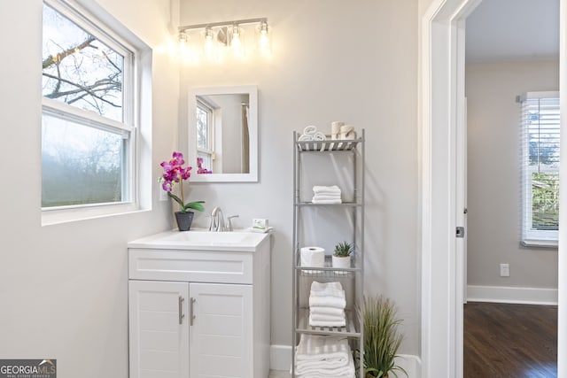 bathroom featuring vanity and hardwood / wood-style flooring