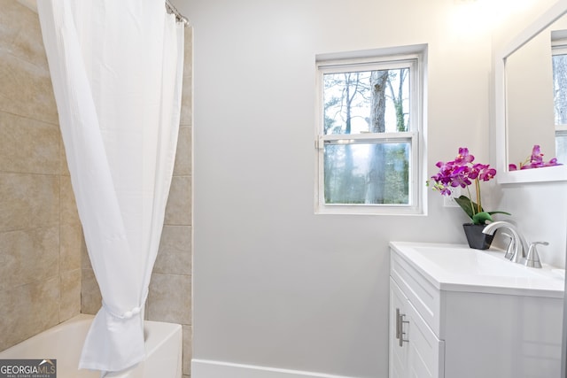 bathroom featuring vanity and shower / bath combo