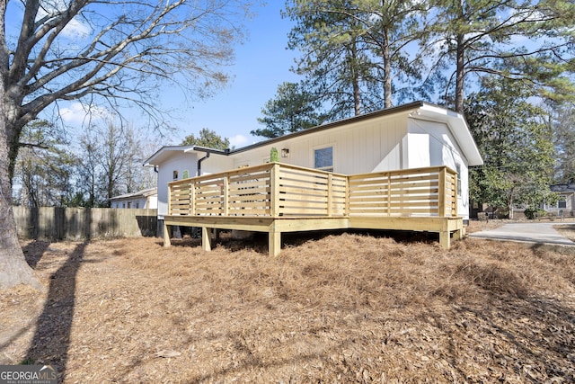 rear view of property with a wooden deck