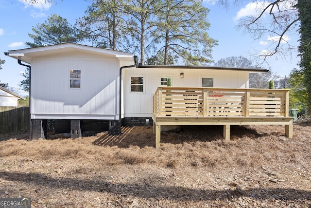 back of property featuring a deck