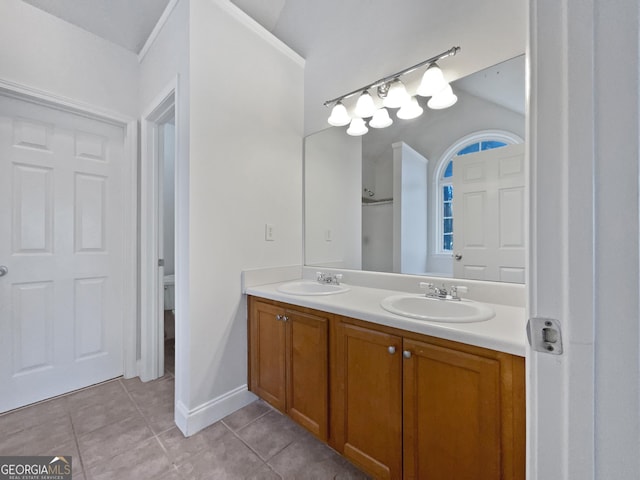 bathroom featuring tile patterned floors, toilet, and vanity