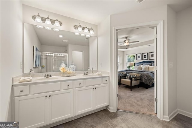 bathroom with vanity, ceiling fan, and walk in shower