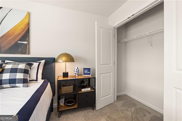 bedroom featuring carpet and a closet