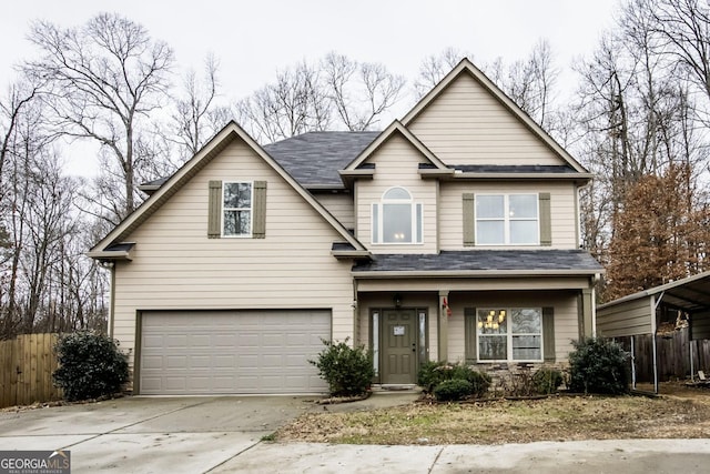 traditional home with a garage, fence, concrete driveway, and roof with shingles