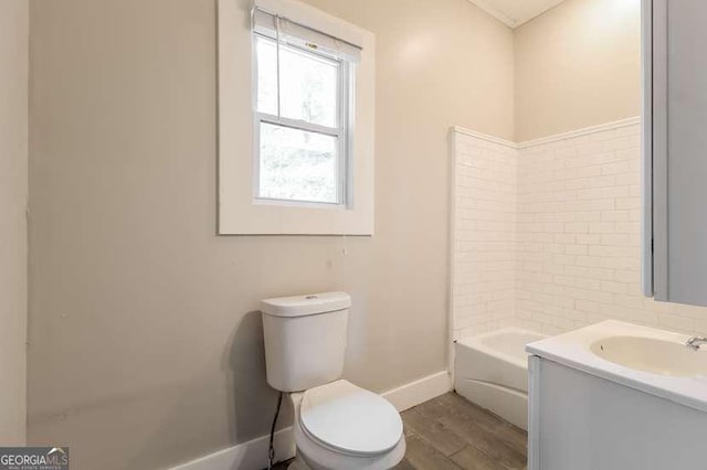 bathroom featuring hardwood / wood-style flooring, vanity, and toilet