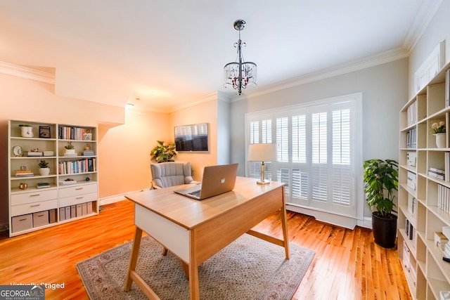 office space featuring a notable chandelier, light wood-style flooring, baseboards, and crown molding