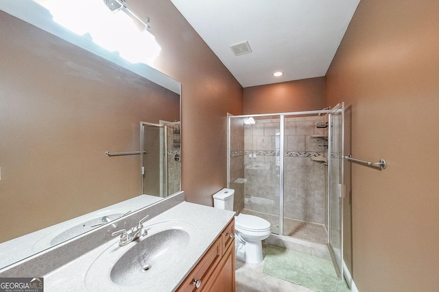 bathroom with walk in shower, vanity, toilet, and tile patterned flooring