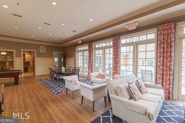 interior space featuring hardwood / wood-style flooring and ornamental molding