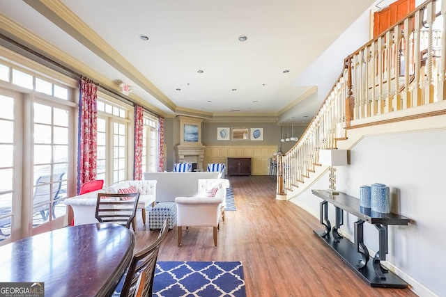 dining area featuring ornamental molding and wood-type flooring