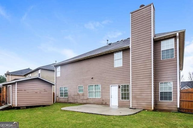 rear view of house featuring a patio and a lawn