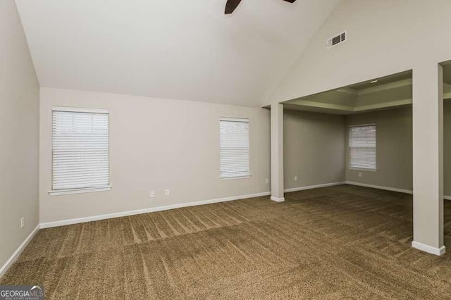 unfurnished room featuring high vaulted ceiling, carpet floors, and ceiling fan