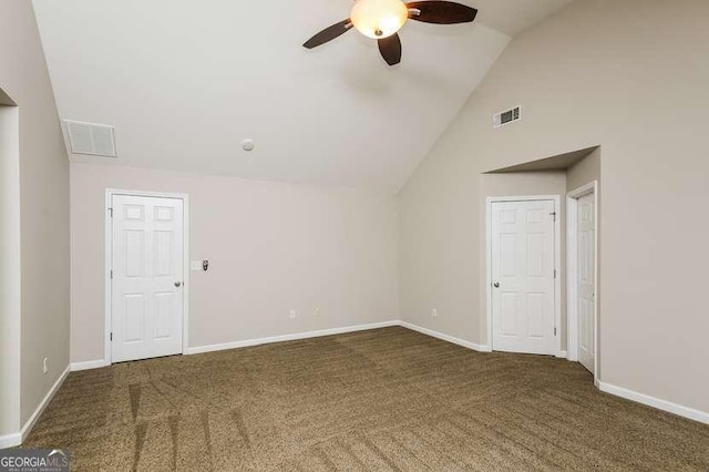 carpeted spare room with lofted ceiling and ceiling fan