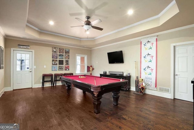 rec room featuring dark wood-type flooring, billiards, ornamental molding, a tray ceiling, and ceiling fan