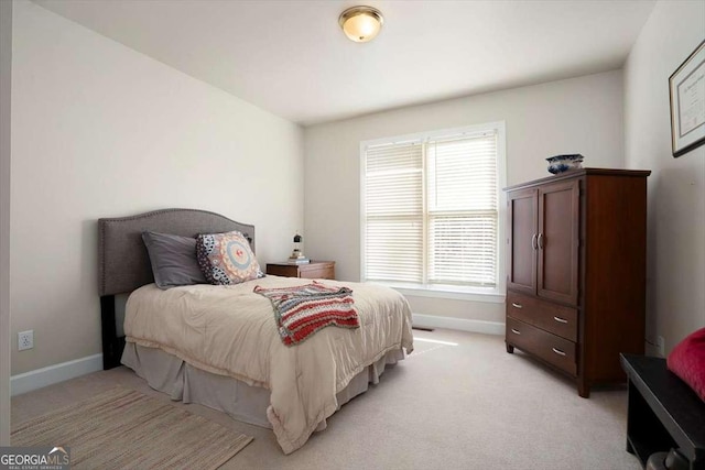 bedroom with light colored carpet